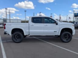 Chevrolet Silverado 1500 RST 4WD Crew Cab 147" 2026 — side view