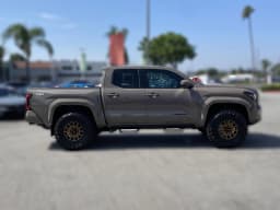 Toyota Tacoma 4WD TRD Sport Double Cab 5' Bed AT (Natl) 2026 — side view
