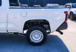 Toyota Tacoma 2WD SR XtraCab 6' Bed AT (Natl) 2026 — side view