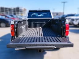 Toyota Tacoma 2WD SR XtraCab 6' Bed AT (Natl) 2026 — side view