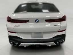 BMW X6 xDrive40i Sports Activity Coupe 2026 — side view