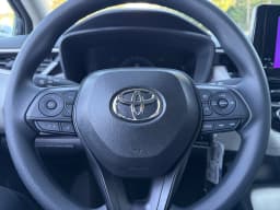 Toyota Corolla LE CVT (Natl) 2027 — side view