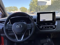 Toyota Corolla Hatchback SE CVT (Natl) 2027 — side view