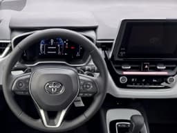 Toyota Corolla Hatchback SE CVT (Natl) 2027 — side view