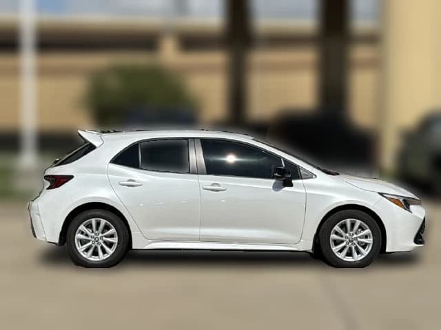 Toyota Corolla Hatchback SE CVT (Natl) 2027 — side view