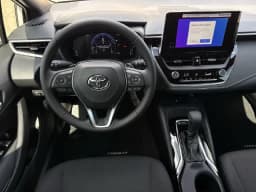 Toyota Corolla Hatchback SE CVT (Natl) 2027 — side view