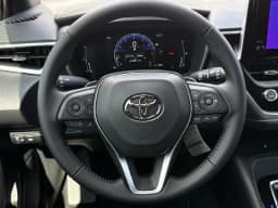 Toyota Corolla Hatchback SE CVT (Natl) 2027 — side view