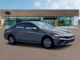 Hyundai Elantra Hybrid Blue Sedan 2026 — side view