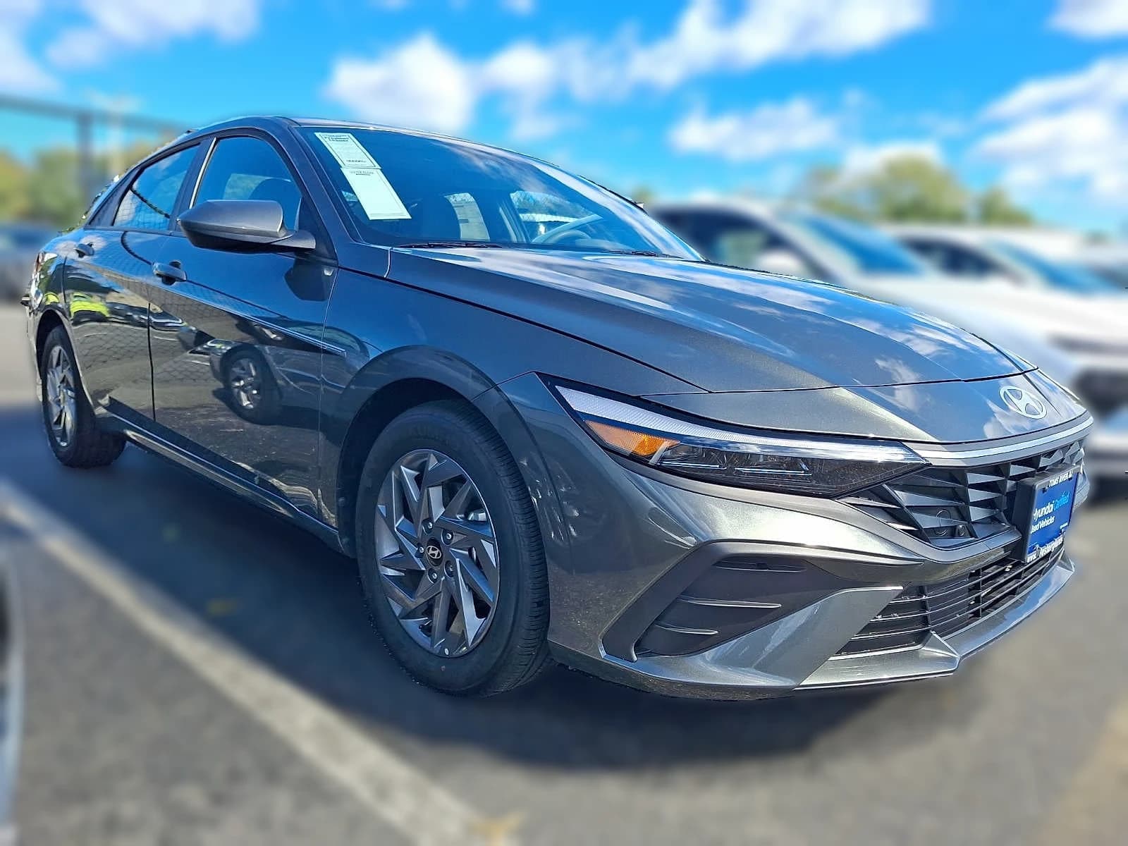 Hyundai Elantra Hybrid Blue Sedan 2026 — side view