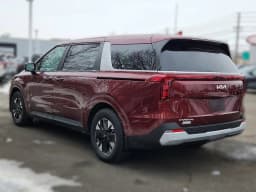Kia Carnival Hybrid LXS FWD 2026 — side view