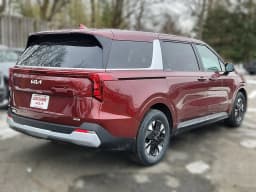 Kia Carnival Hybrid LXS FWD 2026 — side view