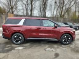 Kia Carnival Hybrid LXS FWD 2026 — side view