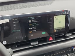Kia Carnival Hybrid LXS FWD 2026 — side view