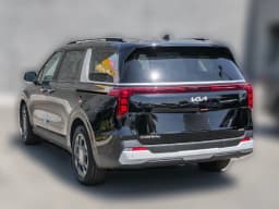 Kia Carnival Hybrid EX FWD 2026 — side view