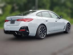 BMW 4 Series M440i xDrive Gran Coupe 2026 — side view