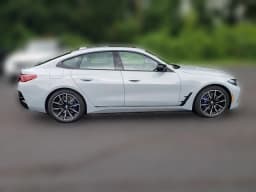 BMW 4 Series M440i xDrive Gran Coupe 2026 — side view