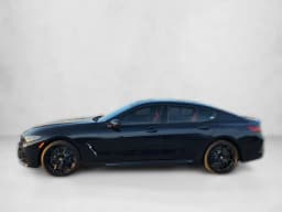 BMW 8 Series M850i Gran Coupe 2026 — side view