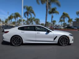 BMW 8 Series M850i Gran Coupe 2026 — side view