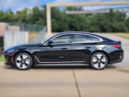 BMW i4 xDrive40 Gran Coupe 2026 — side view
