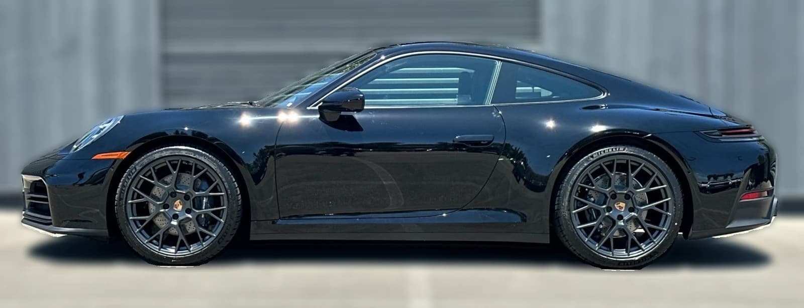 Porsche 911 Carrera Coupe 2026 — side view
