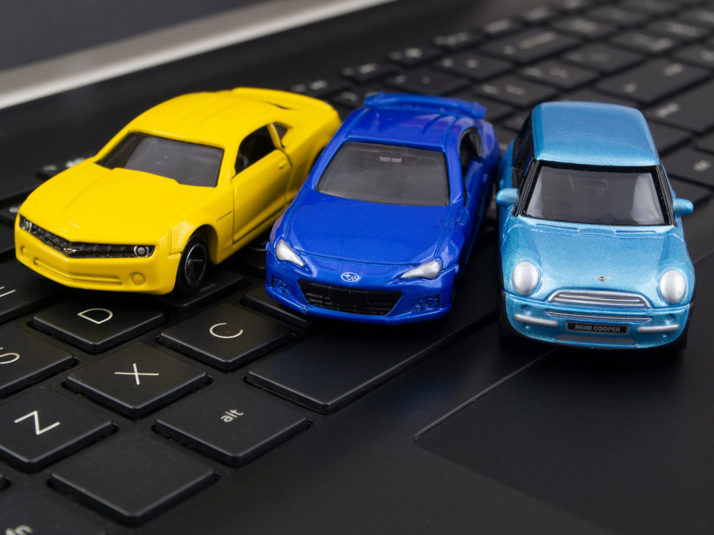 Toy cars on the keyboard