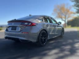 Honda Civic Hatchback Hybrid Sport CVT 2026 — side view