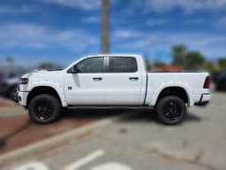 Ram 1500 Laramie 4x4 Crew Cab 5'7" Box 2026 — side view