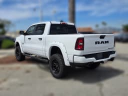 Ram 1500 Laramie 4x4 Crew Cab 5'7" Box 2026 — side view
