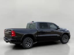 Ram 1500 Laramie 4x4 Crew Cab 5'7" Box 2026 — side view