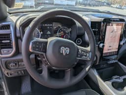 Ram 1500 Laramie 4x4 Crew Cab 5'7" Box 2026 — side view