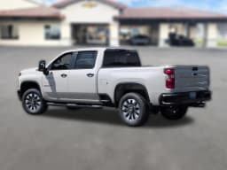 Chevrolet Silverado 2500HD Custom 4WD Crew Cab 159" 2026 — side view