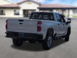 Chevrolet Silverado 2500HD Custom 4WD Crew Cab 159" 2026 — side view