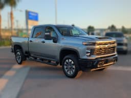 Chevrolet Silverado 2500HD Custom 4WD Crew Cab 159" 2026 — side view