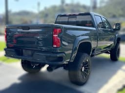 Chevrolet Silverado 2500HD LTZ 4WD Crew Cab 159" 2026 — side view