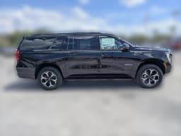 GMC Yukon XL AT4 4WD 4dr 2026 — side view