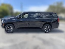GMC Yukon XL AT4 4WD 4dr 2026 — side view