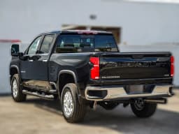 Chevrolet Silverado 2500HD LTZ 4WD Crew Cab 159" 2026 — side view