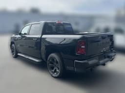 Ram 1500 Express 4x4 Crew Cab 5'7" Box 2026 — side view