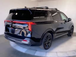 Kia Carnival SX Prestige FWD 2026 — side view