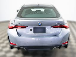 BMW i4 xDrive40 Gran Coupe 2026 — side view